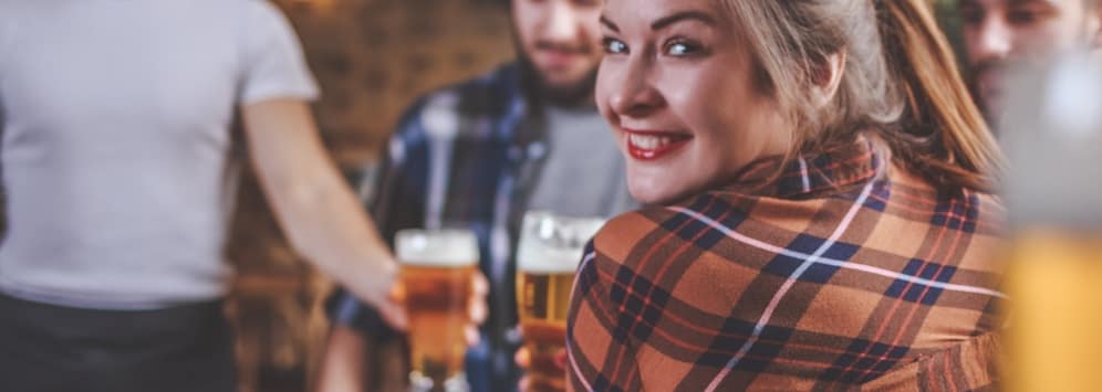 Woman at brewery with friends