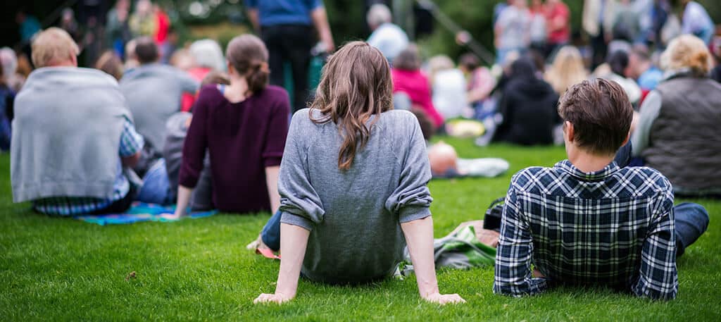 Couple sitting in field at event
