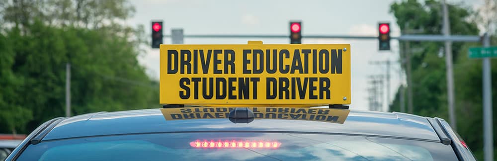 Driver Education Student Driver sign on top of car