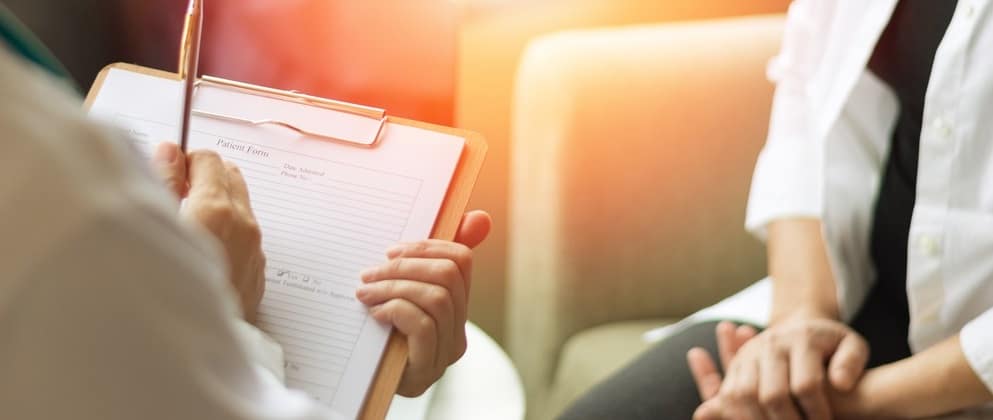 Doctor counseling woman